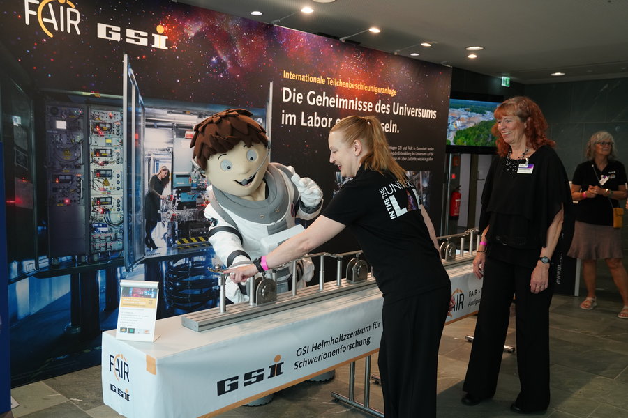 An astronaut mascot from the BMFTR stopped by the booth.