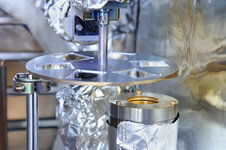 On this picture you see a detailed view of the magnetron source with a substrate holder above